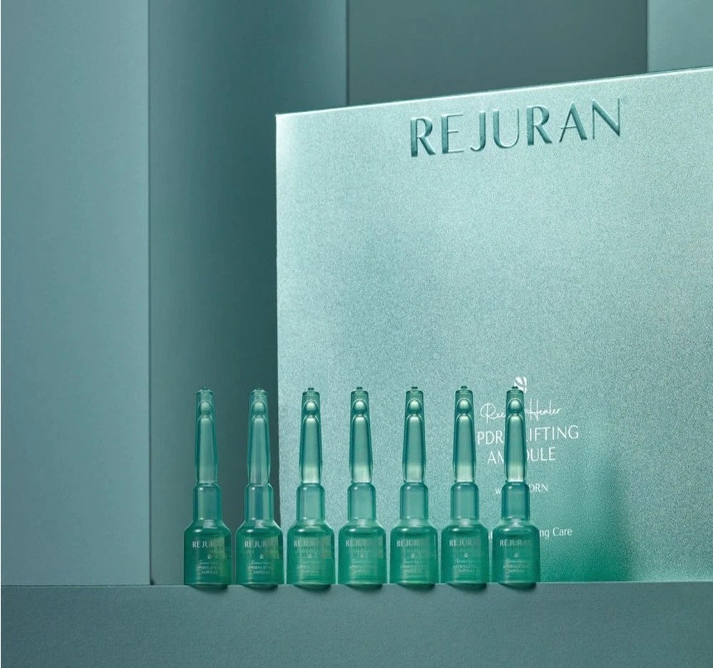 REJURAN Recover Healer c-PDRN Lifting Ampoule 2mL x 14ea Set of green skincare bottles with REJURAN packaging in the background