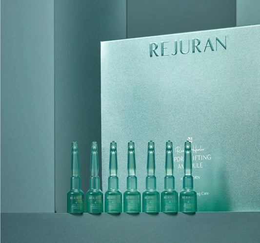 REJURAN Recover Healer c-PDRN Lifting Ampoule 2mL x 14ea Set of green skincare bottles with REJURAN packaging in the background